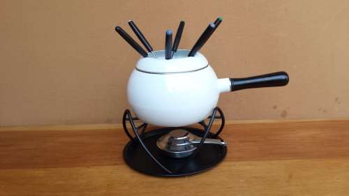 Beautiful white enemel fondu set.