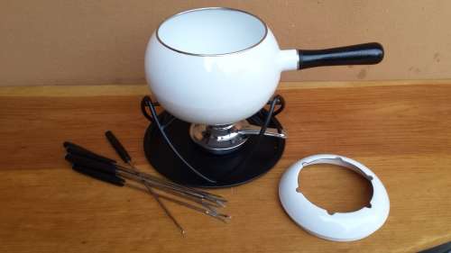 Beautiful white enemel fondu set.