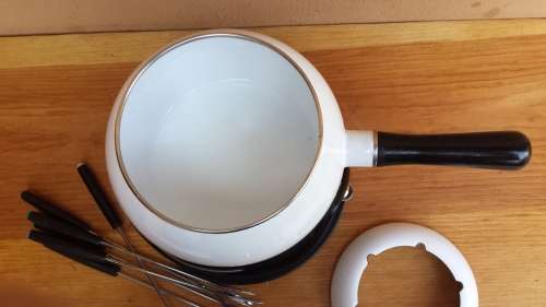 Beautiful white enemel fondu set.