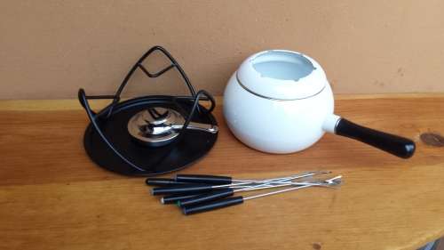 Beautiful white enemel fondu set.