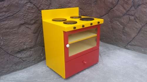 Beautiful kids play stove.