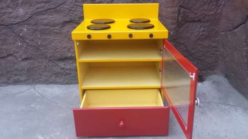 Beautiful kids play stove.