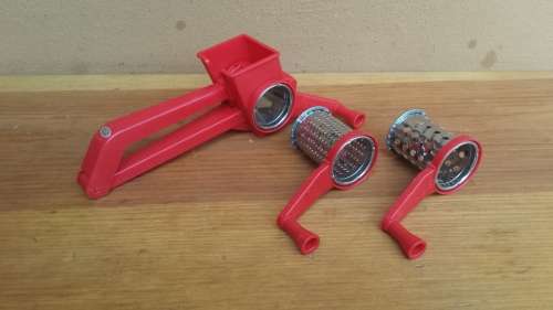 Lovely red plastic hand grater.