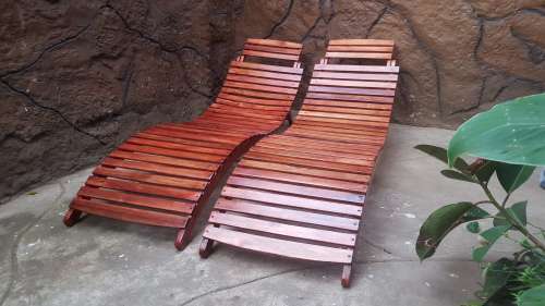 Beautiful pair of wooden garden loungers.