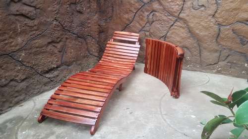 Beautiful pair of wooden garden loungers.