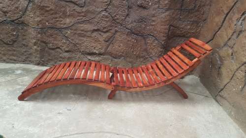 Beautiful pair of wooden garden loungers.