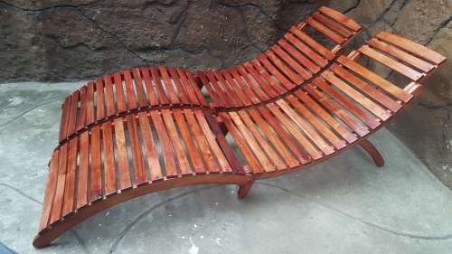 Beautiful pair of wooden garden loungers.