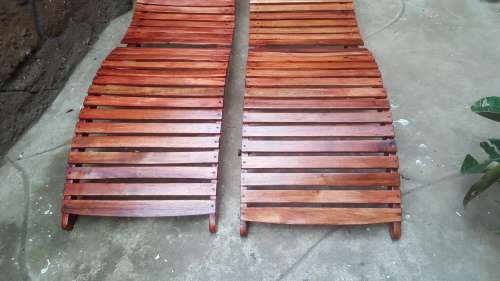Beautiful pair of wooden garden loungers.