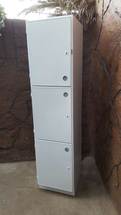 Awesome, tall metal kitchen cupboard.