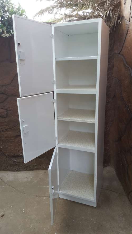 Awesome, tall metal kitchen cupboard.