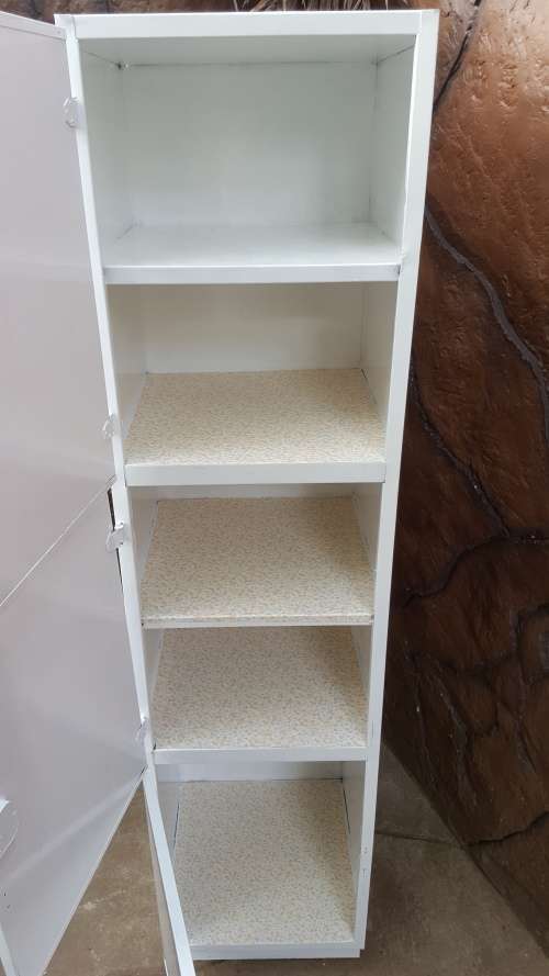 Awesome, tall metal kitchen cupboard.