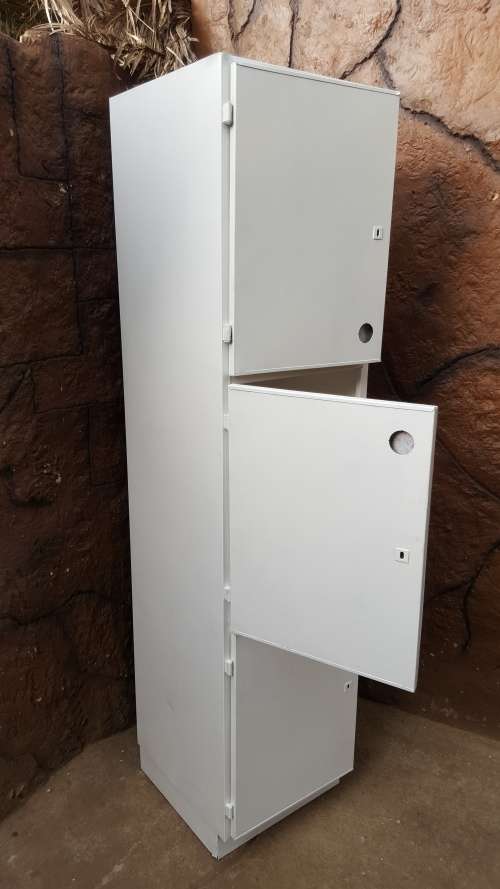 Awesome, tall metal kitchen cupboard.