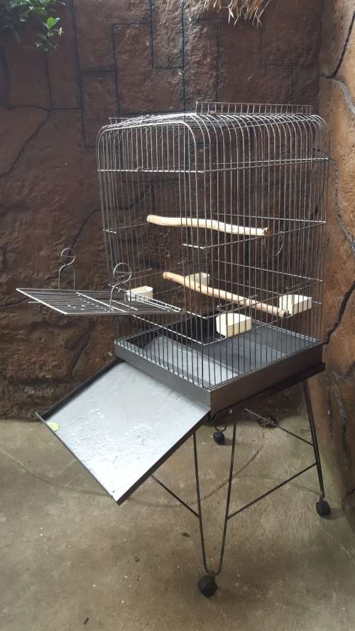 Lovely, large parrot cage on a stand.