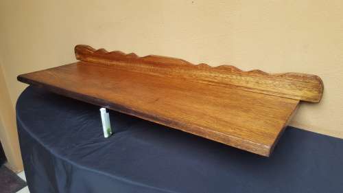 Old decorative wooden wall shelf.
