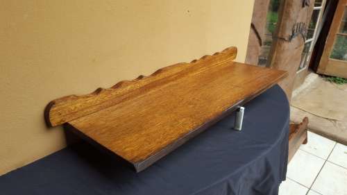 Old decorative wooden wall shelf.