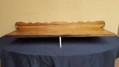 Old decorative wooden wall shelf.