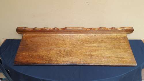 Old decorative wooden wall shelf.