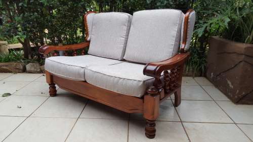 Beautiful wooden 6 seater lounge suite.