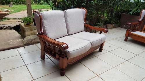 Beautiful wooden 6 seater lounge suite.