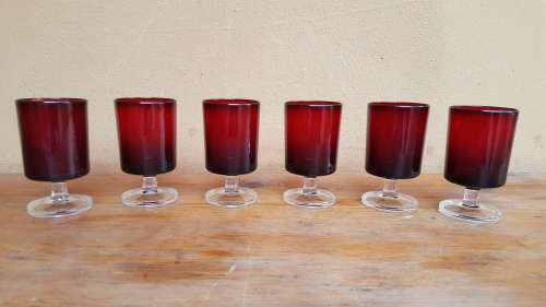 Set of 6 cranberry red sherry glasses.