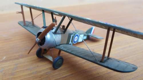 Pair of small metal aeroplanes.