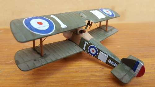 Pair of small metal aeroplanes.