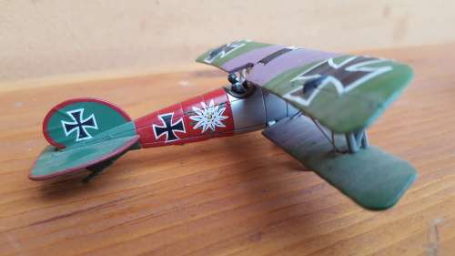 Pair of small metal aeroplanes.