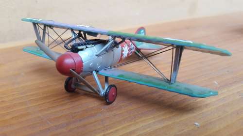 Pair of small metal aeroplanes.