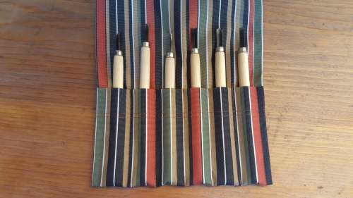 Lovely old wood carving set.