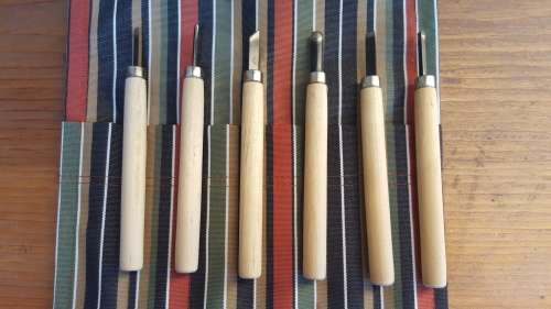 Lovely old wood carving set.