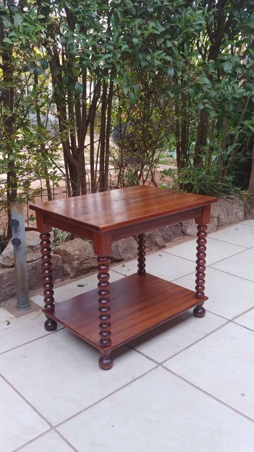 Beautiful old two tier bauble leg coffee table.
