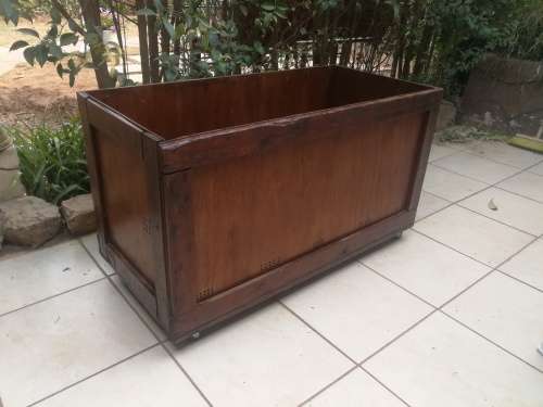 Large wooden box on wheels.