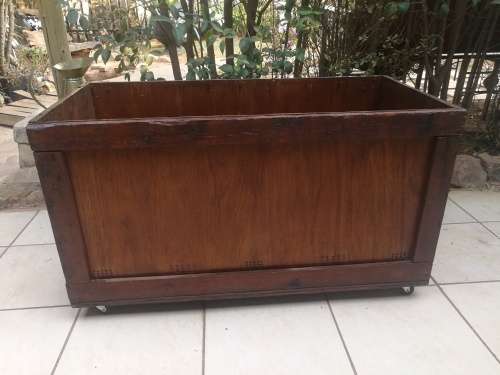 Large wooden box on wheels.