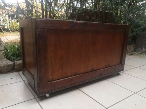 Large wooden box on wheels.