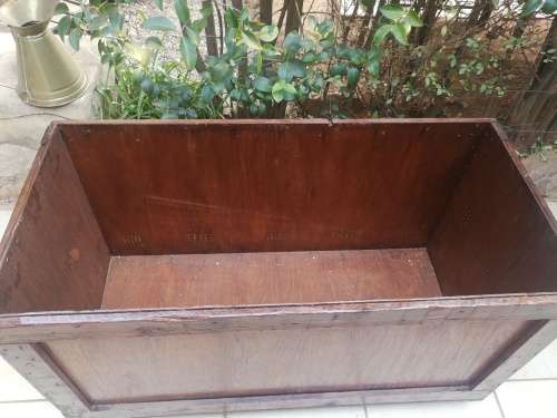 Large wooden box on wheels.