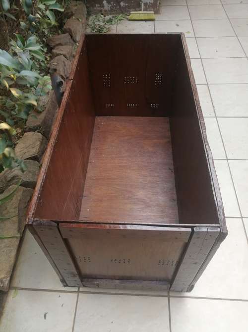 Large wooden box on wheels.