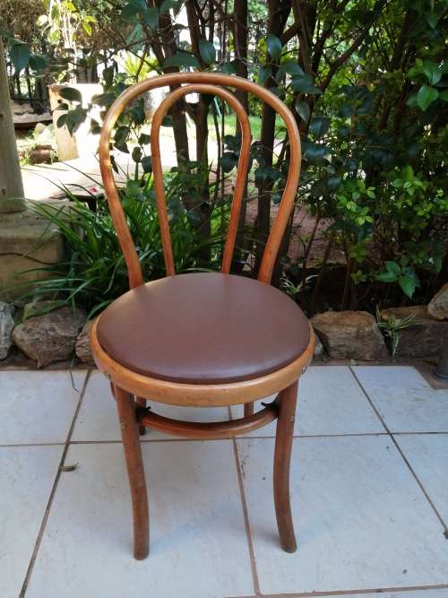 Beautiful old bentwood globe chair.