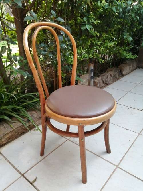 Beautiful old bentwood globe chair.