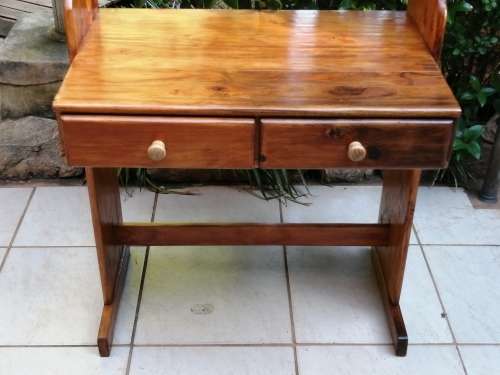 Tall, pine shelved study desk.