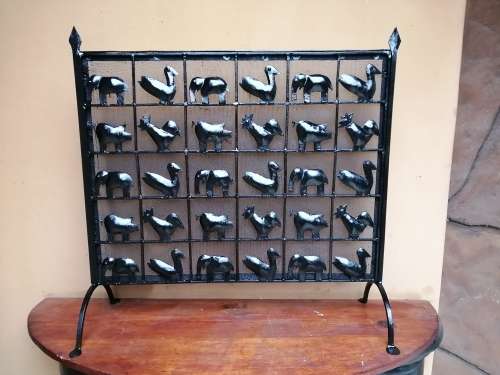 Beautiful, old metal birds and animals fire screen.