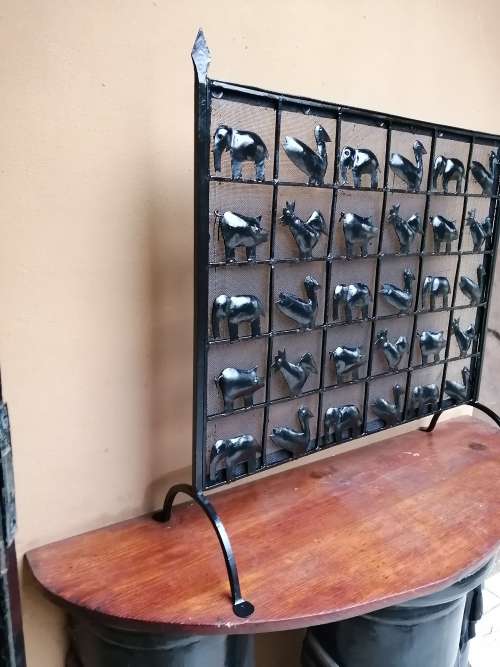 Beautiful, old metal birds and animals fire screen.