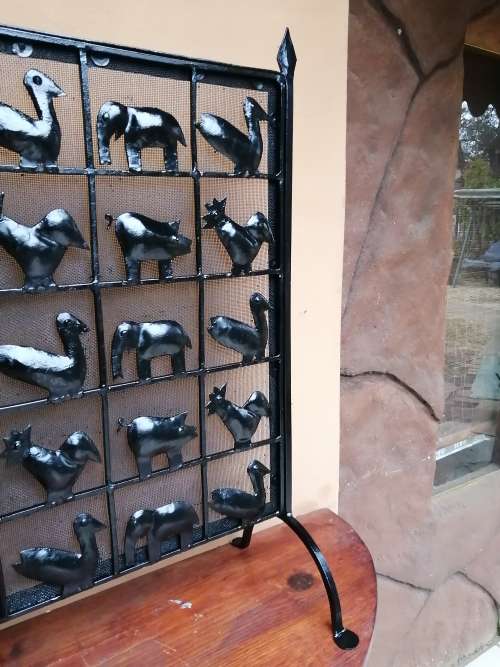 Beautiful, old metal birds and animals fire screen.