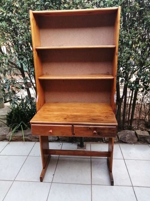 Tall, pine shelved study desk.