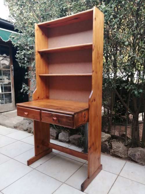 Tall, pine shelved study desk.