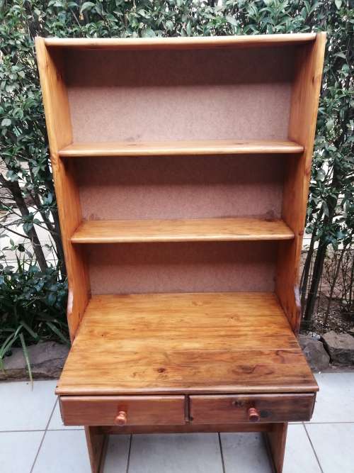 Tall, pine shelved study desk.