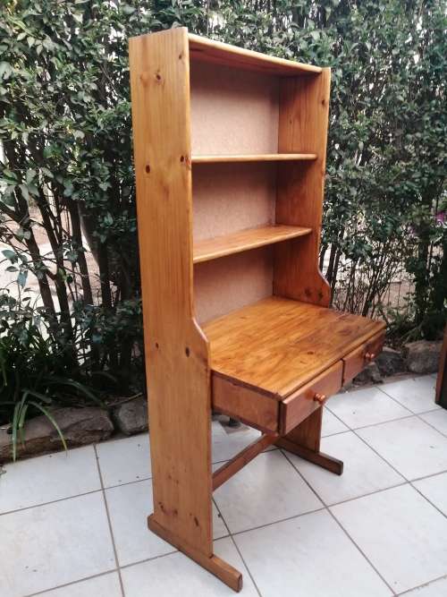 Tall, pine shelved study desk.