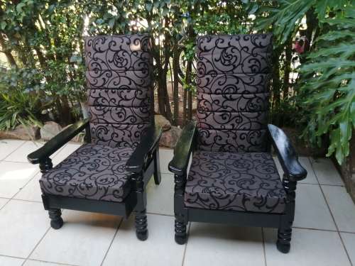 Beautiful pair of black high back arm chairs.