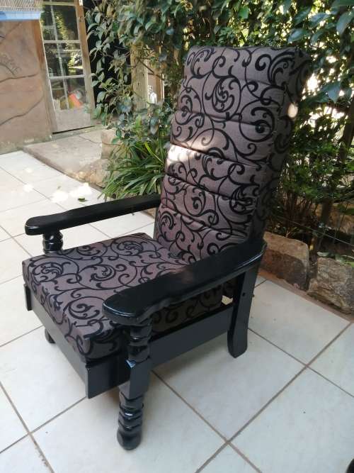 Beautiful pair of black high back arm chairs.