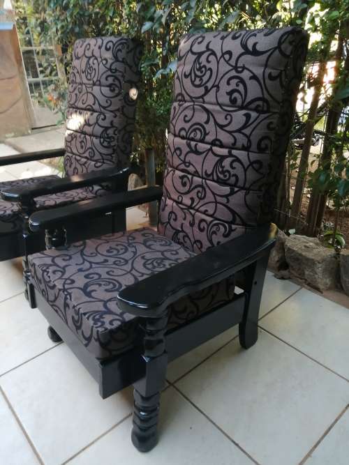 Beautiful pair of black high back arm chairs.