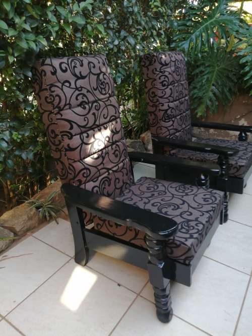Beautiful pair of black high back arm chairs.